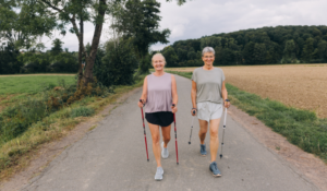 Friends walking with walking sticks.