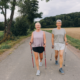 Friends walking with walking sticks.