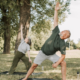 Couple doing yoga in the park