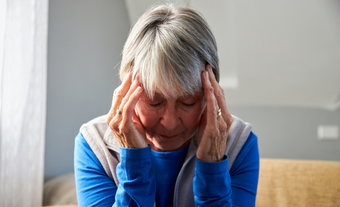 Woman with her head in her hands