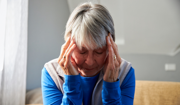 Woman with her head in her hands