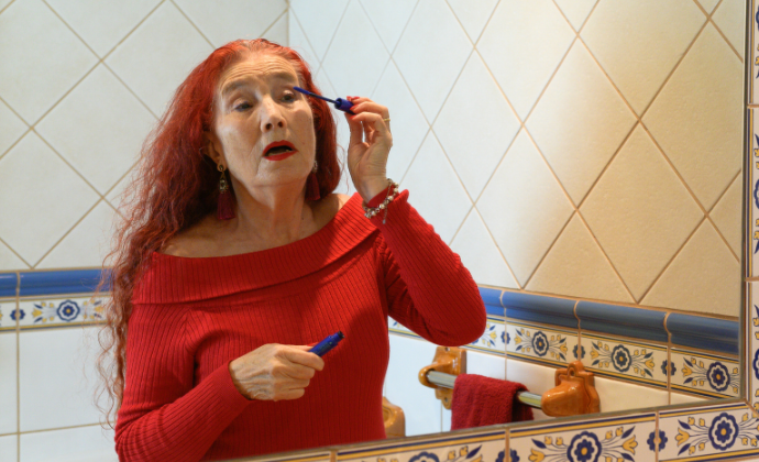 Lady applying make up