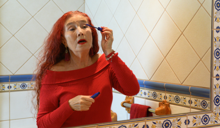 Lady applying make up