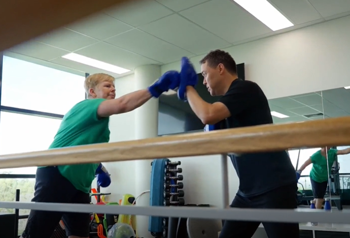 Two people boxing