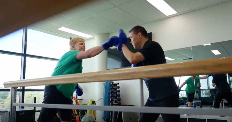 Two people boxing