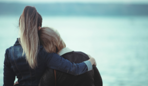 Two women hugging