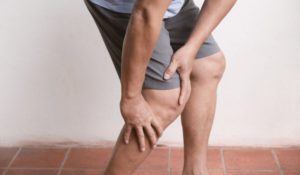 Person pressing on their legs