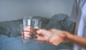 Glass of water shaking in hands