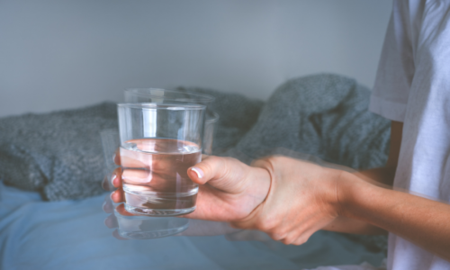 Glass of water shaking in hands