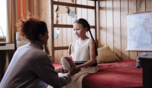 Woman taking to child