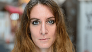 lady staring at camera with no facial expression