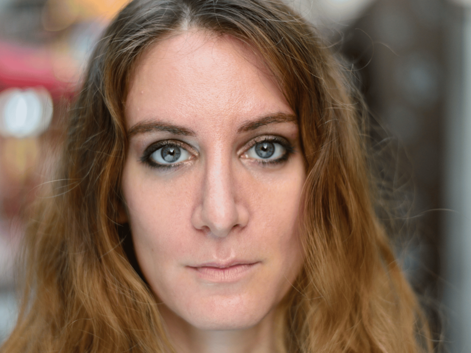 lady staring at camera with no facial expression