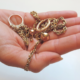 Hand holding gold jewellry