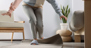 Older person tripping over mat